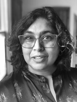 A black and white photo of [Aruna D'Souza]