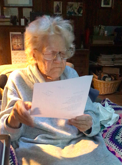 A photo of Mary Norbert Korte reading a piece of paper.