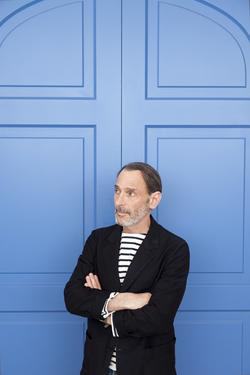 Photo of David Salle in front of a blue door. Photo of David Salle in front of a blue door.