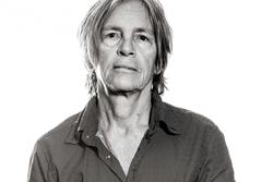 A black and white photo of poet Eileen Myles.