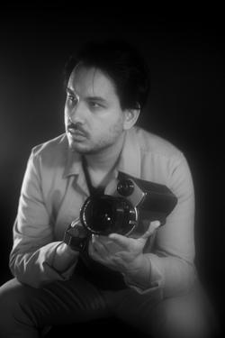 Black and white photo of Suneil Sanzgiri