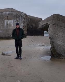 Picture of Julian Charrière on a beach.