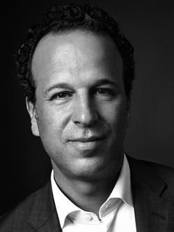 This is a black and white photo of Mark Lubell, Executive Director of the International Center of Photography.