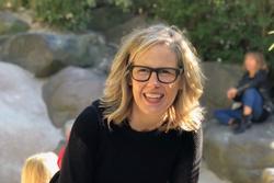 Photo of Lissa McClure in front of a rocky background. 