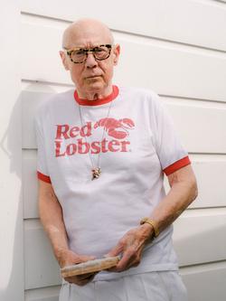 A portrait of Ron Nagle wearing a Red Lobster t-shirt