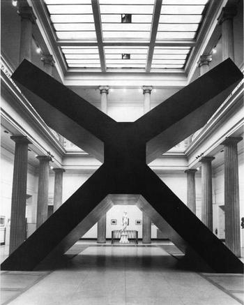 A black and white photo of the New York artist, Ronald Bladen's sculpture "X"