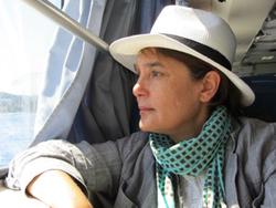 Photo of Safaa Fathy looking out of a window. Photo of Safaa Fathy looking out of a window.