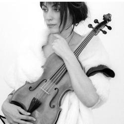Black and white photo of Sarah Sarhandi holding a viola.