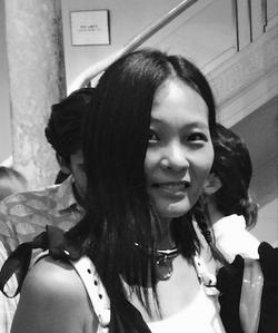 A black and white photo of poet and writer Sarah Wang.