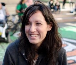 A photograph of poet Wendy Trevino smiling.